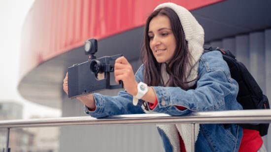 Woman holding iOgrapher case